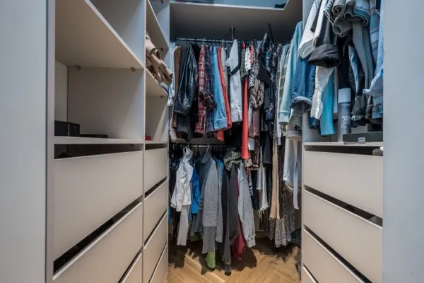 Messy or empty wardrobe closet space before AI staging